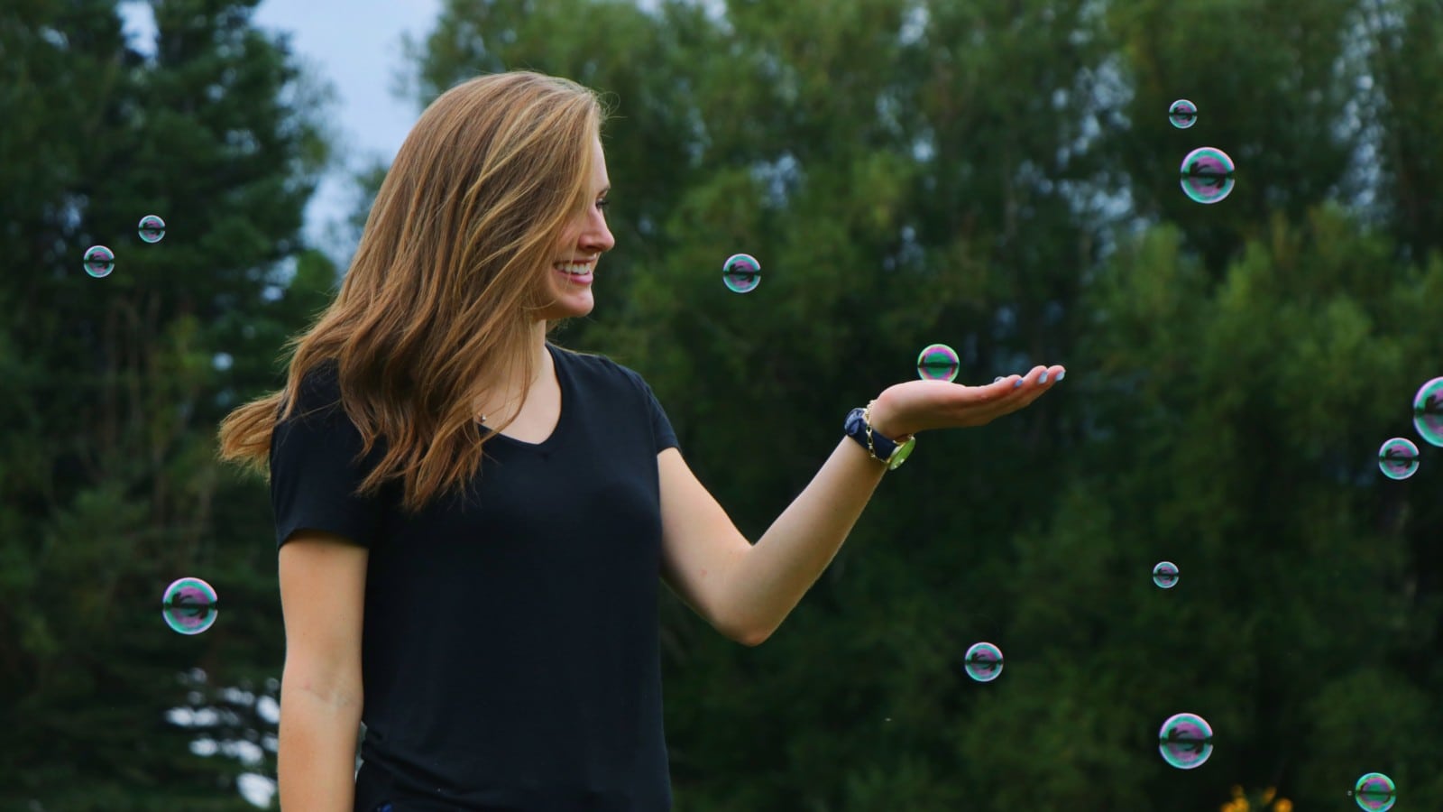woman playing with bubbles