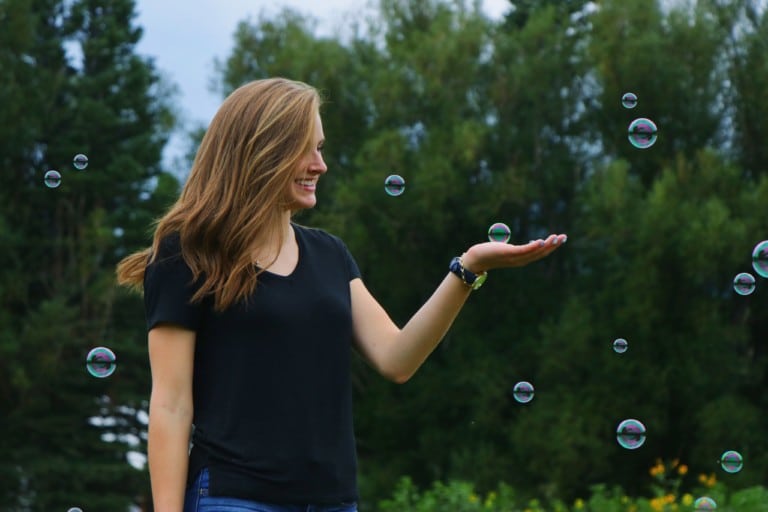 woman playing with bubbles